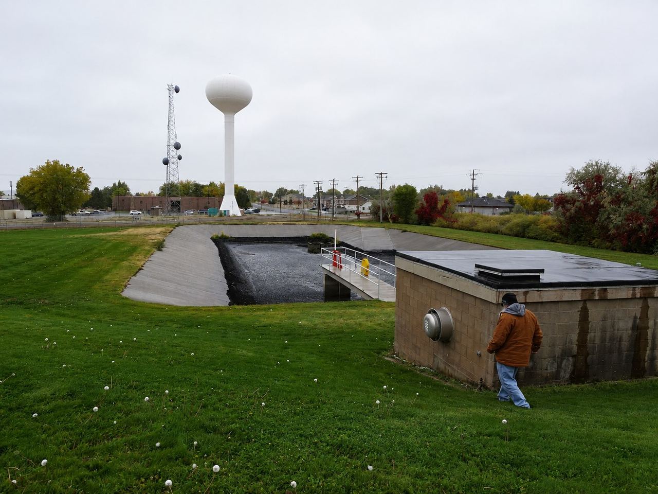 Community water tower overlooking a municipal park and storage basin