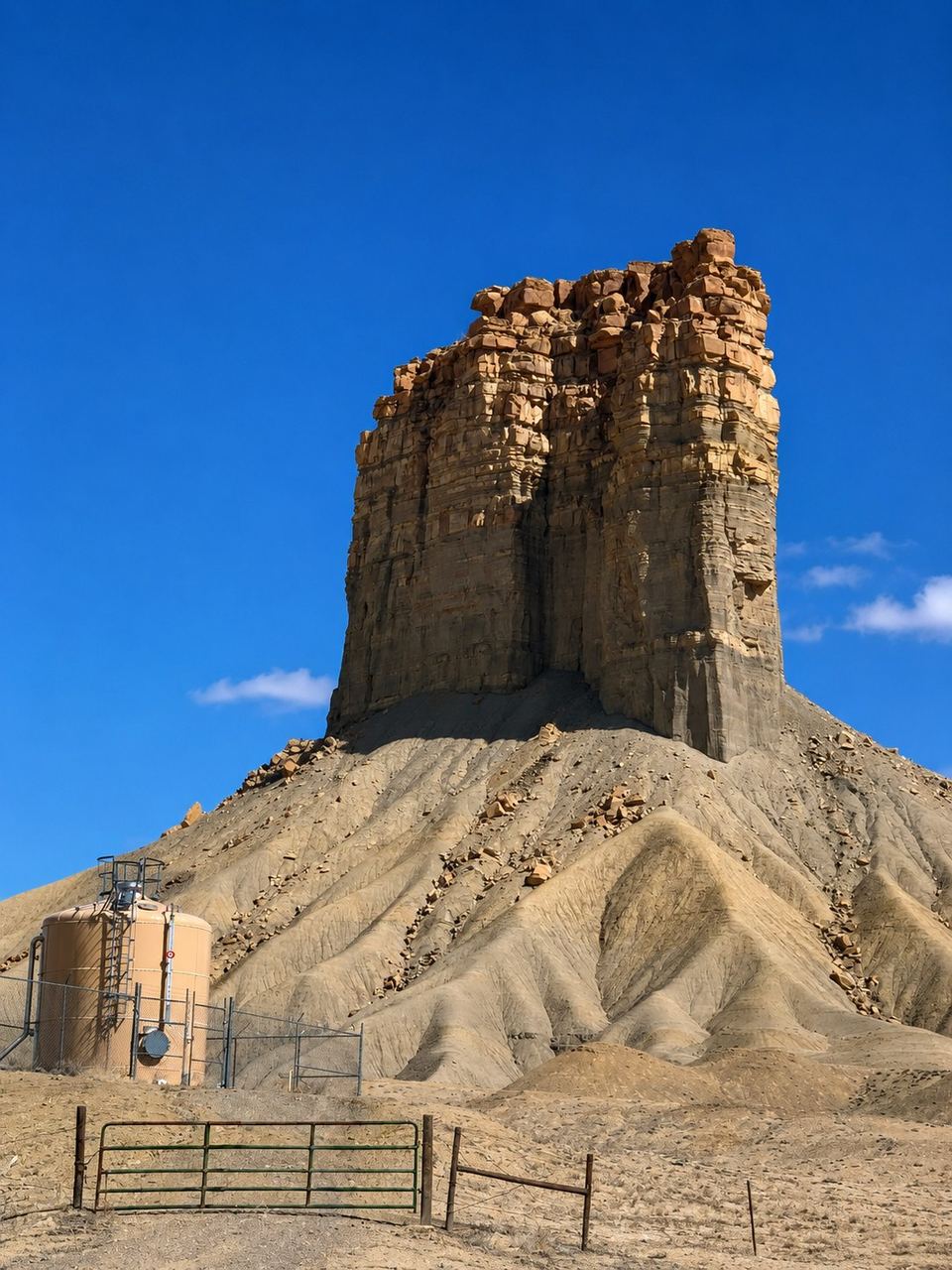 Eroded rock chimney landmark beside a rural water system site